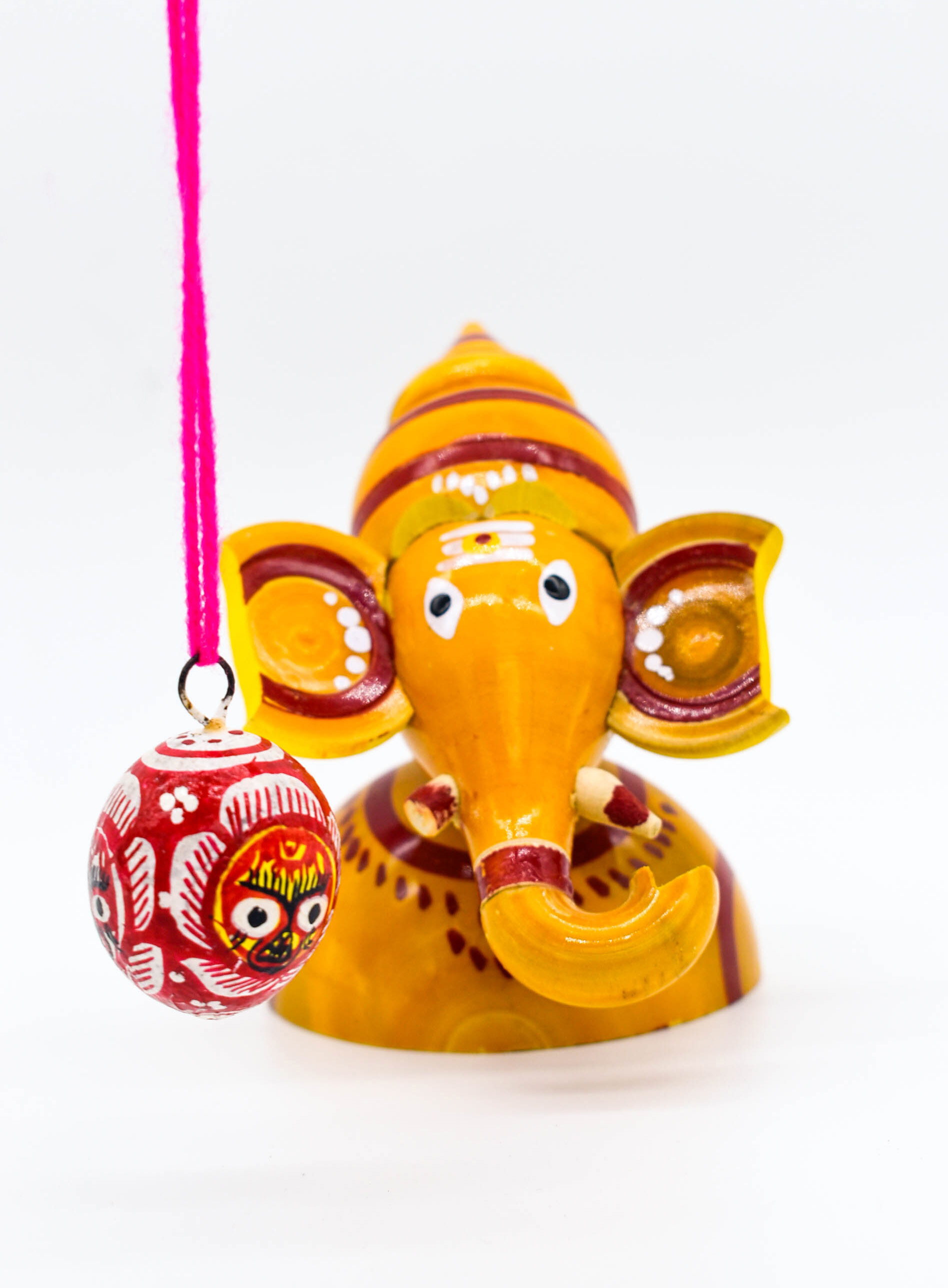 Handcrafted Indian Car Dashboard Ganesh Figurine with Jagannath Hanging Ornament on Beetle nut, multicolored Handcrafted Indian Car Dashboard Ganesh Figurine with Jagannath Hanging Ornament on Beetle nut, multicolored