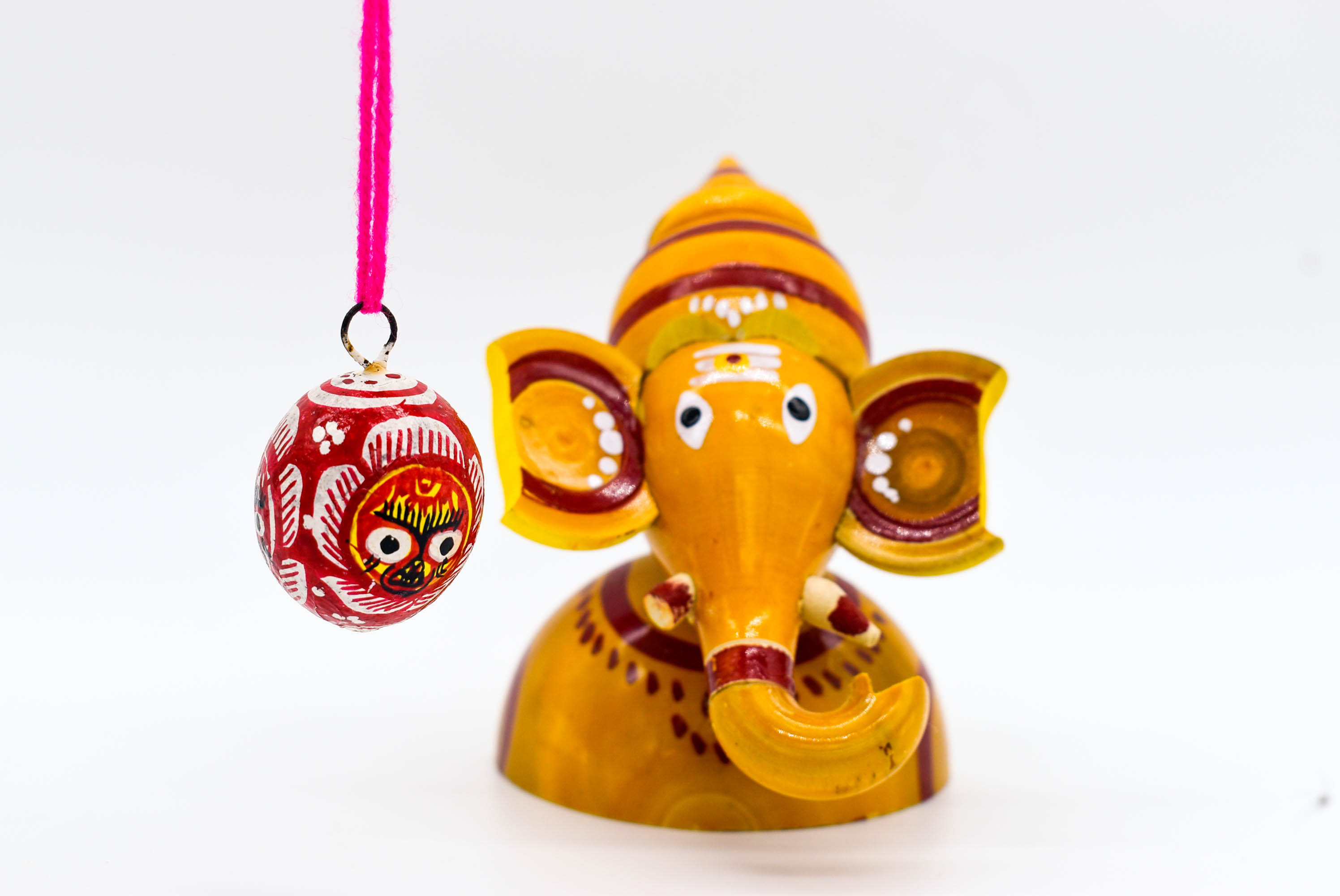 Handcrafted Indian Car Dashboard Ganesh Figurine with Jagannath Hanging Ornament on Beetle nut, multicolored Handcrafted Indian Car Dashboard Ganesh Figurine with Jagannath Hanging Ornament on Beetle nut, multicolored