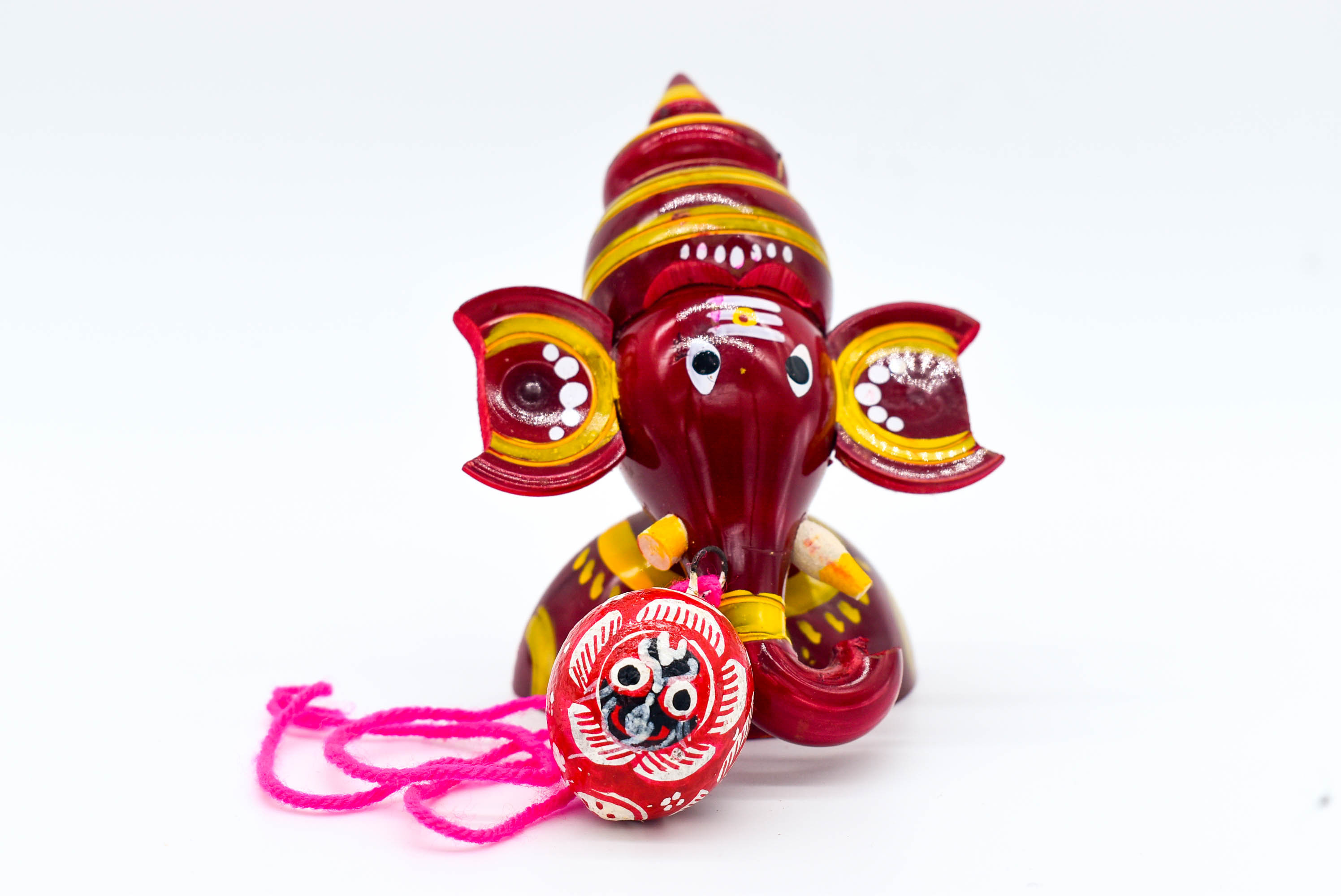 Handcrafted Indian Car Dashboard Ganesh Figurine with Jagannath Hanging Ornament on Beetle nut, multicolored Handcrafted Indian Car Dashboard Ganesh Figurine with Jagannath Hanging Ornament on Beetle nut, multicolored