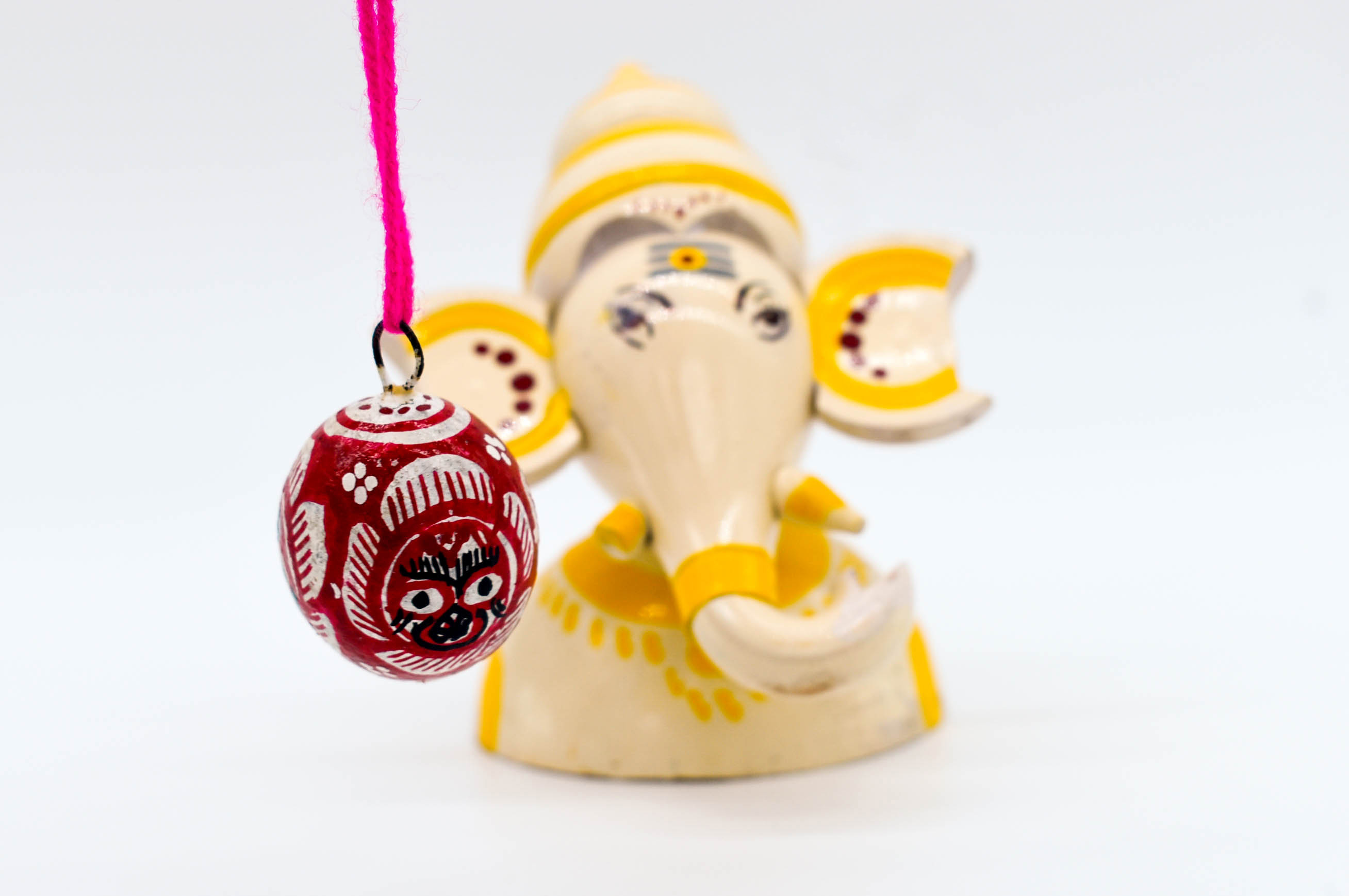 Handcrafted Indian Car Dashboard Ganesh Figurine with Jagannath Hanging Ornament on Beetle nut, multicolored Handcrafted Indian Car Dashboard Ganesh Figurine with Jagannath Hanging Ornament on Beetle nut, multicolored