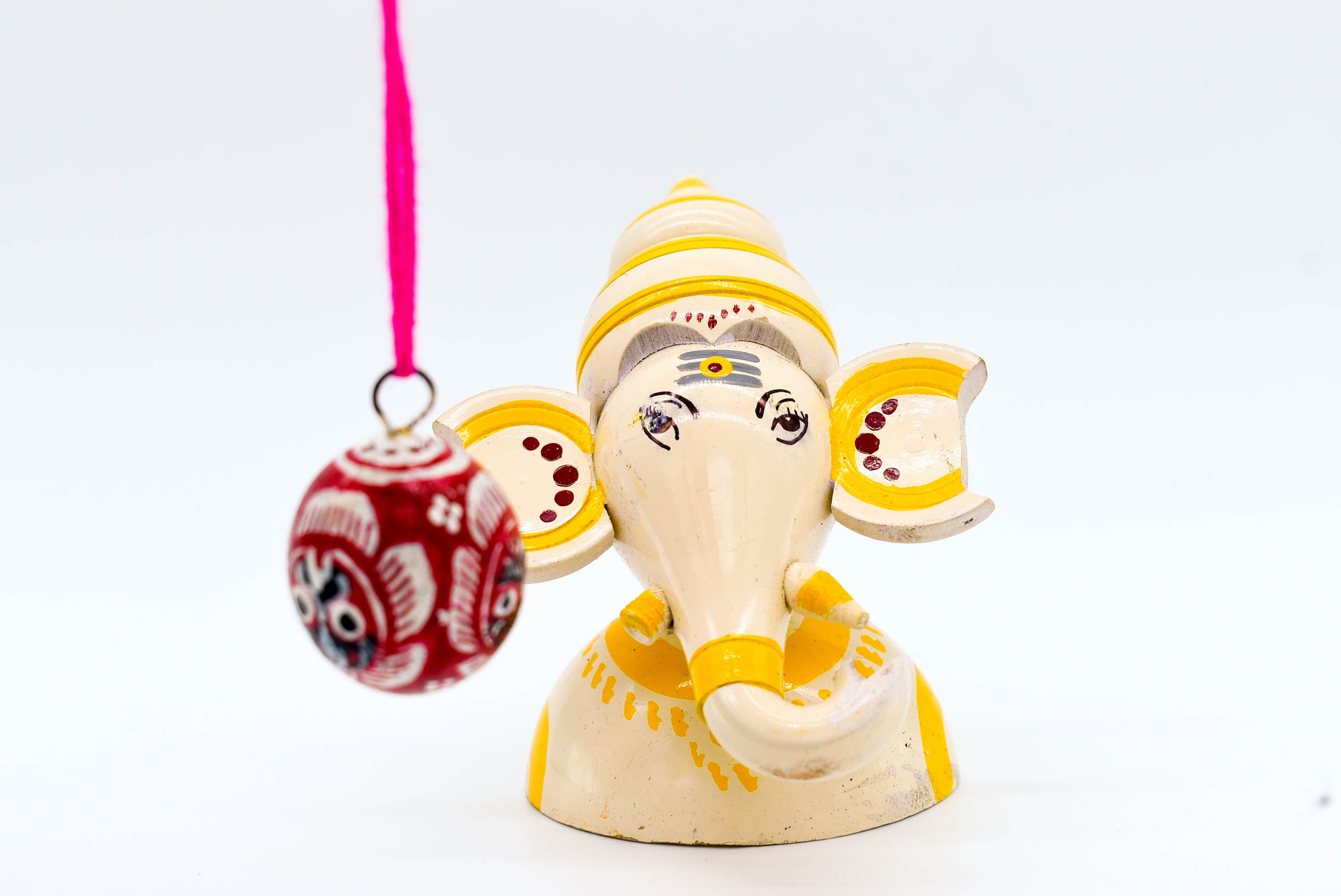 Handcrafted Indian Car Dashboard Ganesh Figurine with Jagannath Hanging Ornament on Beetle nut, multicolored Handcrafted Indian Car Dashboard Ganesh Figurine with Jagannath Hanging Ornament on Beetle nut, multicolored