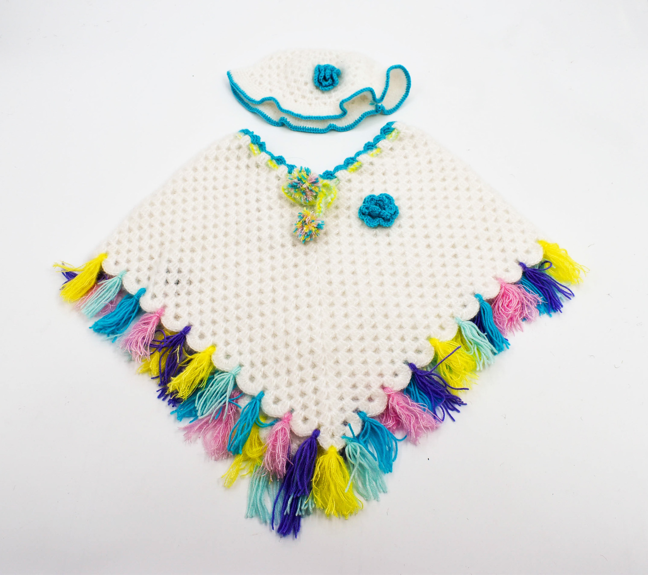 Handknitted Kids Woolen Poncho and Cap Set, White with Multicolor Tassels (1-3 Years) Handknitted Kids Woolen Poncho and Cap Set, White with Multicolor Tassels (1-3 Years)