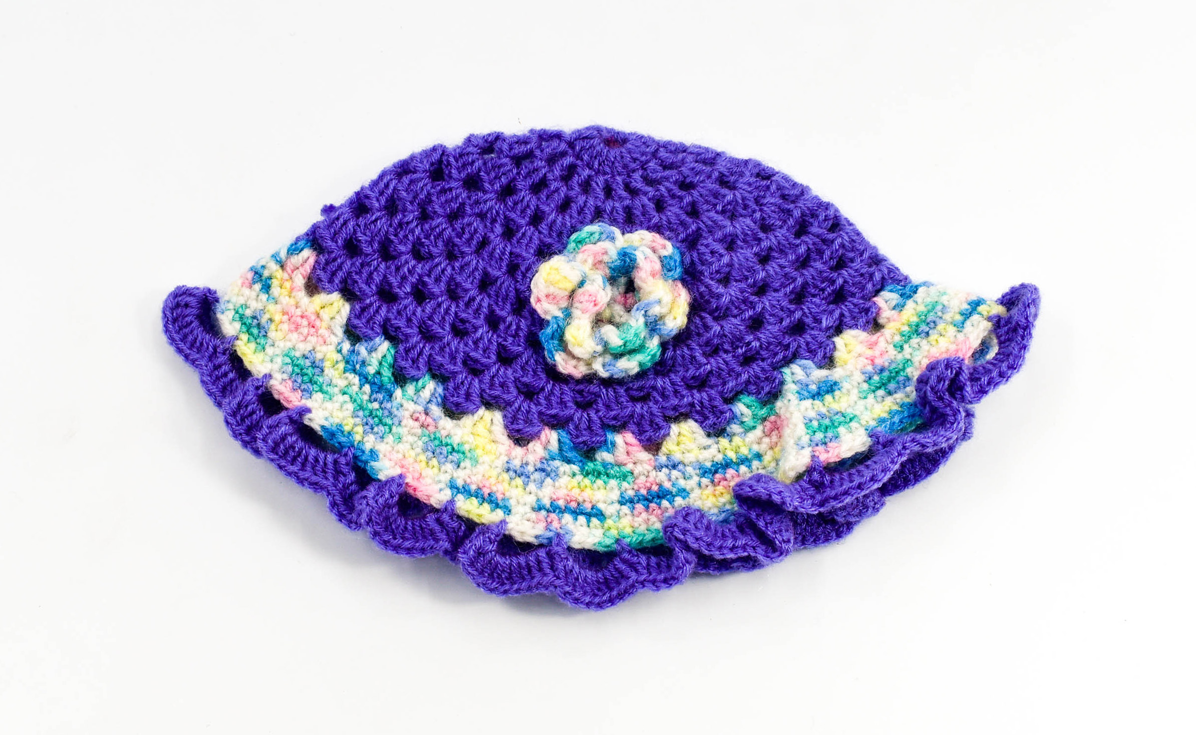 Handknitted multicolored woolen poncho with cap (0 months to 6 months) Handknitted multicolored woolen poncho with cap (0 months to 6 months)